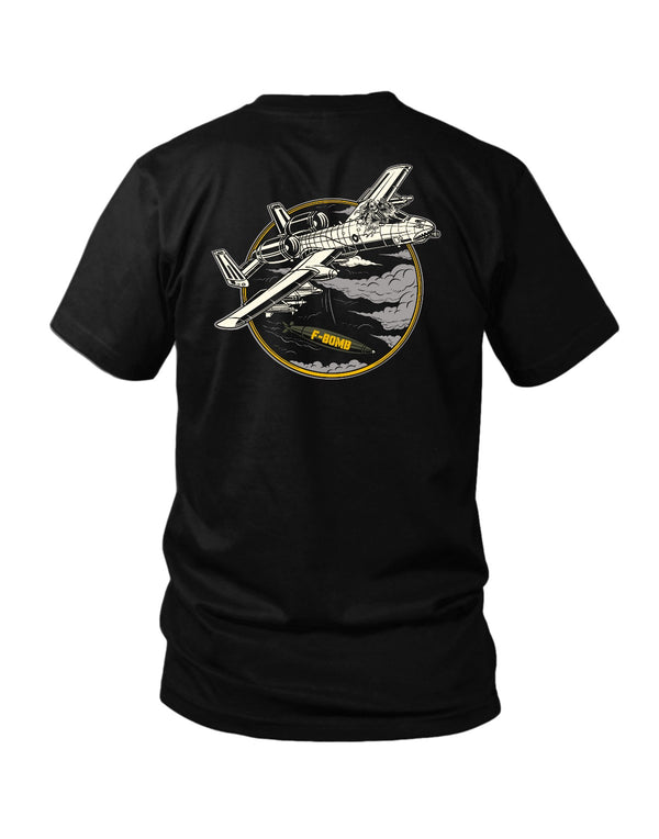 Savage Tacticians Black tee featuring an A-10 Warthog attack aircraft with shark-teeth nose art and a skeletal reaper pilot, an "F-Bomb" missile below, inside a circular badge.