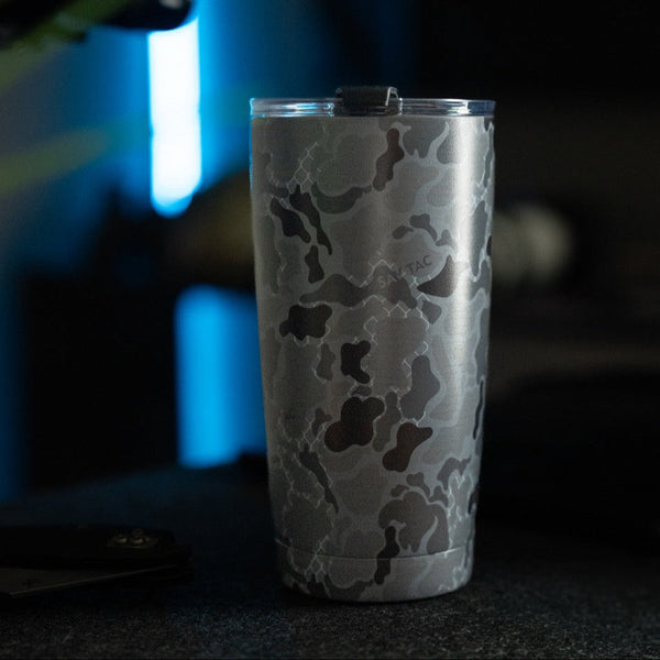 Savage Tacticians camo stainless steel tumbler with lid on dark surface