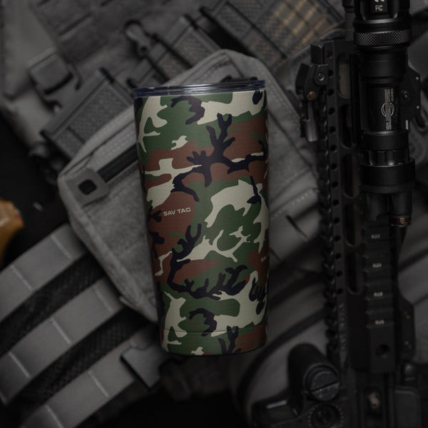 Savage Tacticians camo tumbler with SAV TAC logo, tactical gear and rifle background