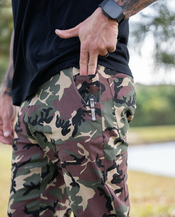 Savage Tacticians camo pants with knife clip in pocket, worn outdoors