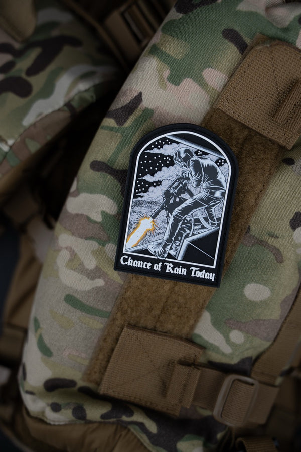 Savage Tacticians morale patch with soldier graphic on camouflage tactical backpack