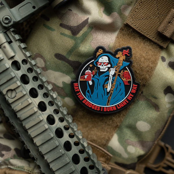 Savage Tacticians morale patch with grim reaper design on tactical vest, camo gear