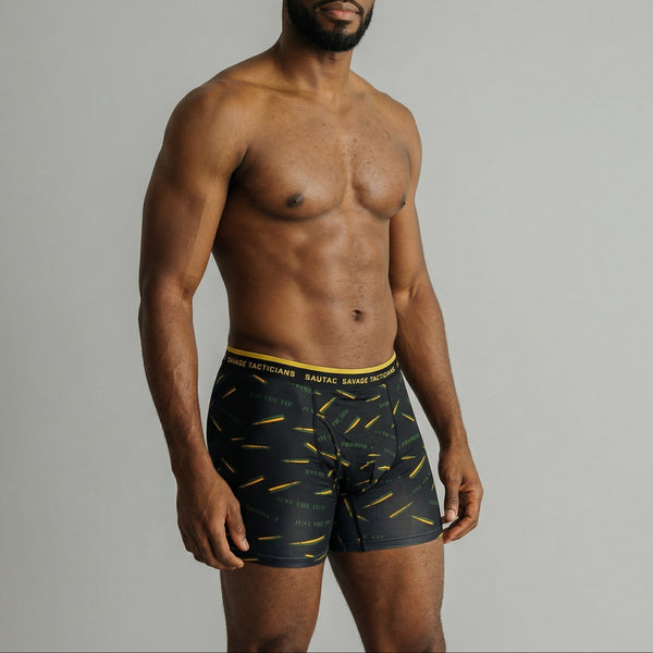Male model wearing Savage Tacticians black boxer briefs with bullet pattern