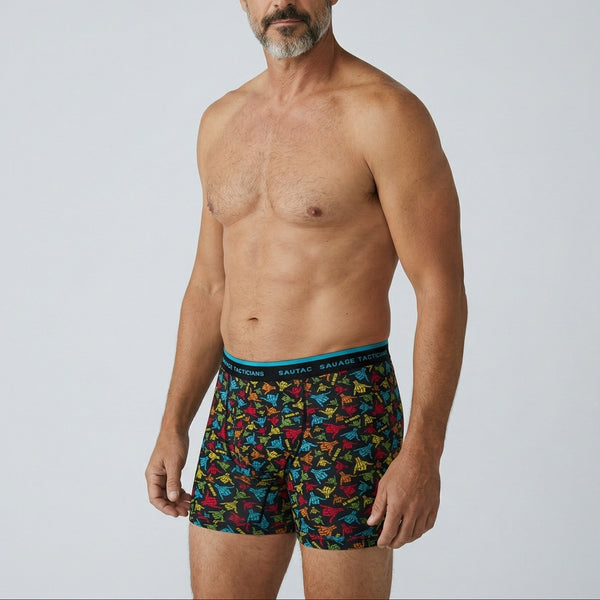 Man modeling Savage Tacticians colorful patterned boxer briefs with branded waistband