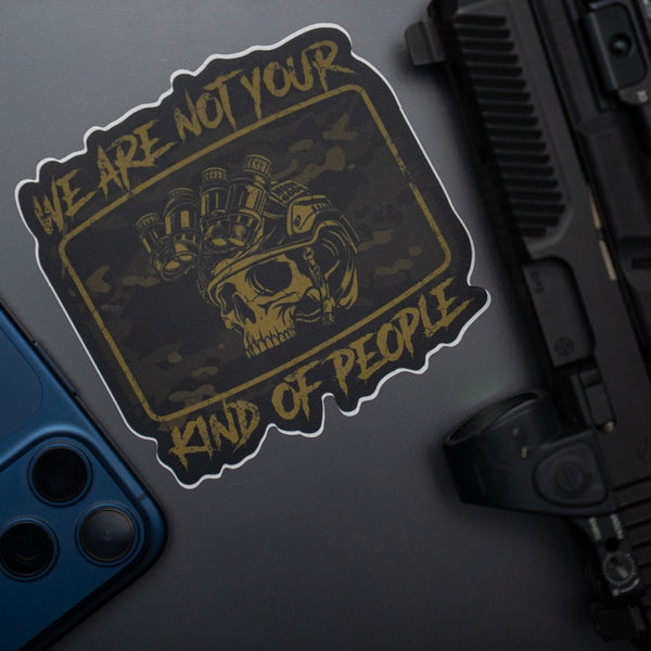 Savage Tacticians skull sticker with night vision and 'We are not your kind of people' text on laptop