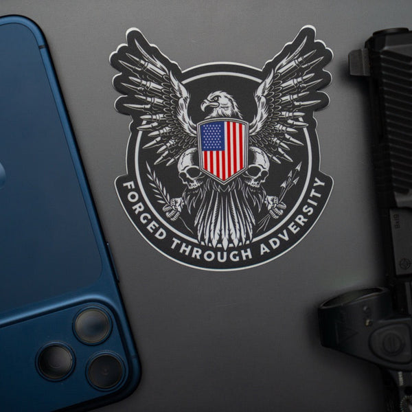 Savage Tacticians eagle sticker with US flag shield and 'Forged Through Adversity' text