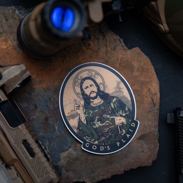 Savage Tacticians sticker featuring a bearded man in camo holding a pistol, labeled God's Plaid