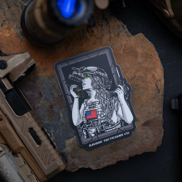 Savage Tacticians sticker featuring a tactical woman with night vision goggles and American flag patch.