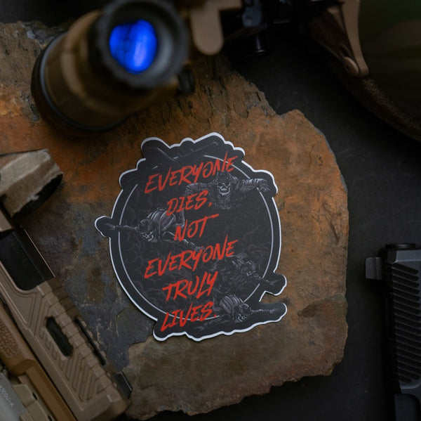 Savage Tacticians sticker with 'Everyone dies, not everyone truly lives' text on stone surface