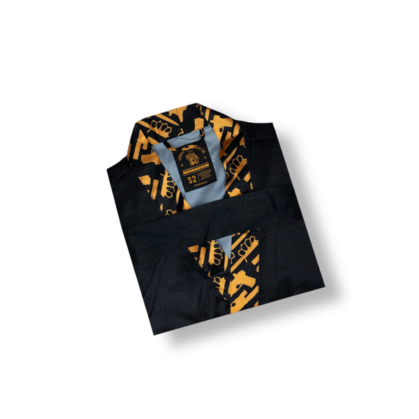 Savage Tacticians black shirt with bold orange and black inner collar graphic pattern