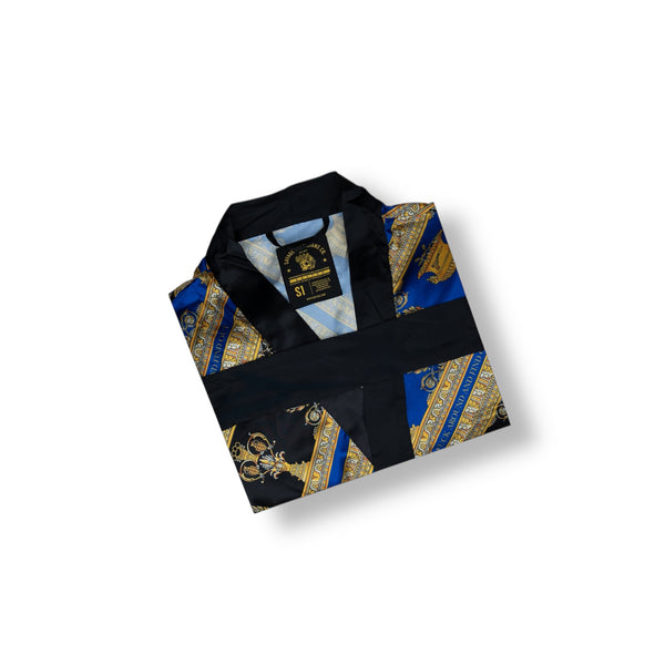 Savage Tacticians blue and black kimono with gold ornate design, folded neatly