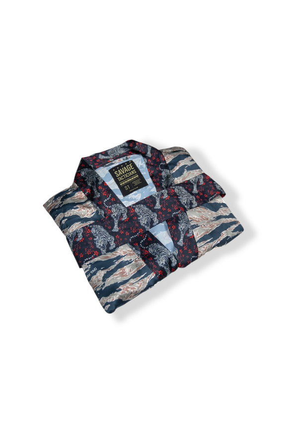 Savage Tacticians patterned button-up shirt with tiger and wave design, folded neatly