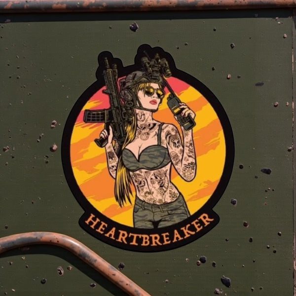 Savage Tacticians Heartbreaker sticker with tattooed woman holding rifle and radio