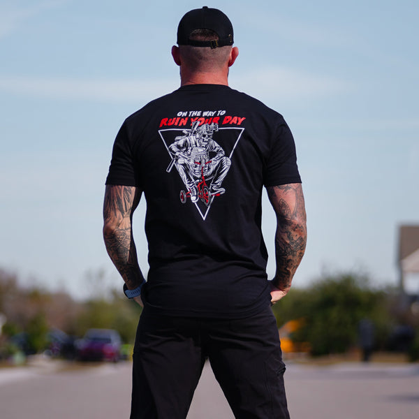 Model wearing the Saboteur graphic tee in a urban setting.