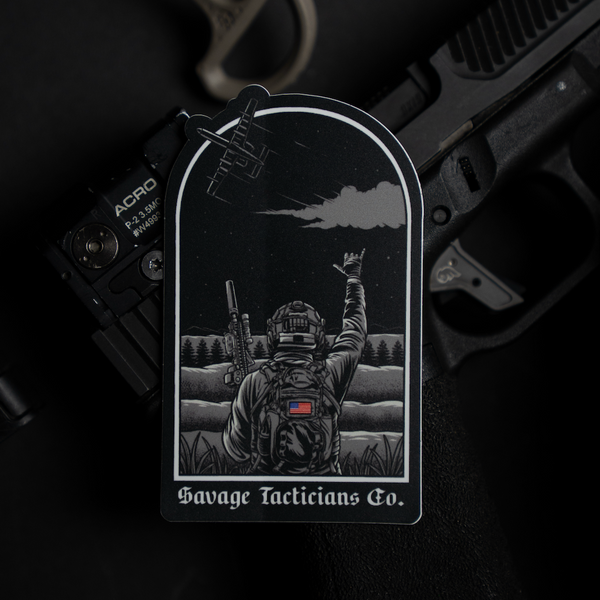 Savage Tacticians sticker with soldier, rifle, and satellite, on black firearm background