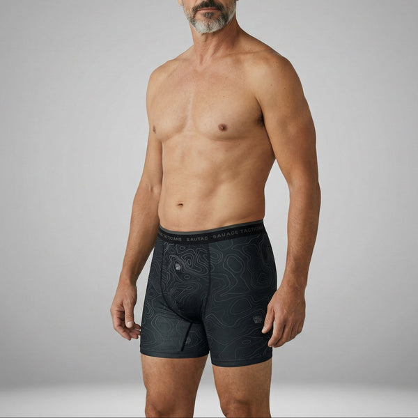 Man wearing Savage Tacticians black boxer briefs with contour line pattern