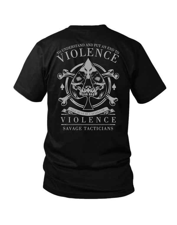 Savage Tacticians Black tee featuring a small gray ace-of-spades emblem with a skull on the left chest, and a larger back design of the same ace-of-spades skull emblem with crossbones, arched text "To Understand And Put An End To Violence," banner "One Must Be Capable Of Violence, Savage Tacticians."