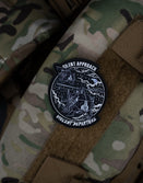 Savage Tacticians Silent Approach Violent Departure patch on camouflage tactical vest