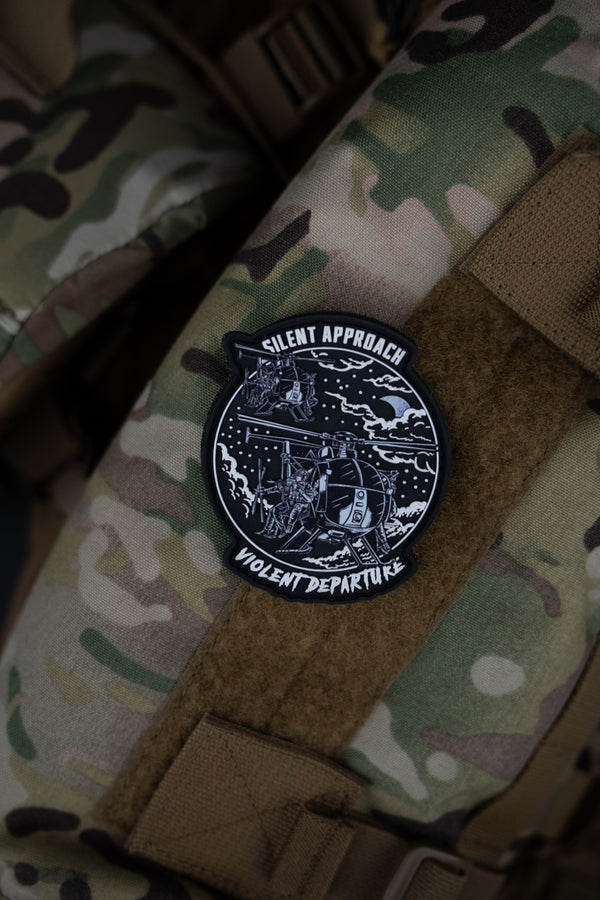Savage Tacticians Silent Approach Violent Departure patch on camouflage tactical vest