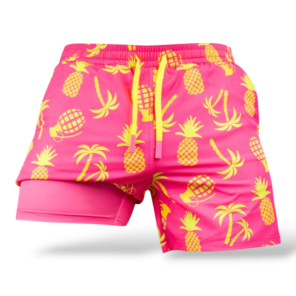 Savage Tacticians pink and yellow pineapple print swim trunks with palm trees