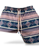 Savage Tacticians men's swim trunks with navy and pink geometric tribal pattern