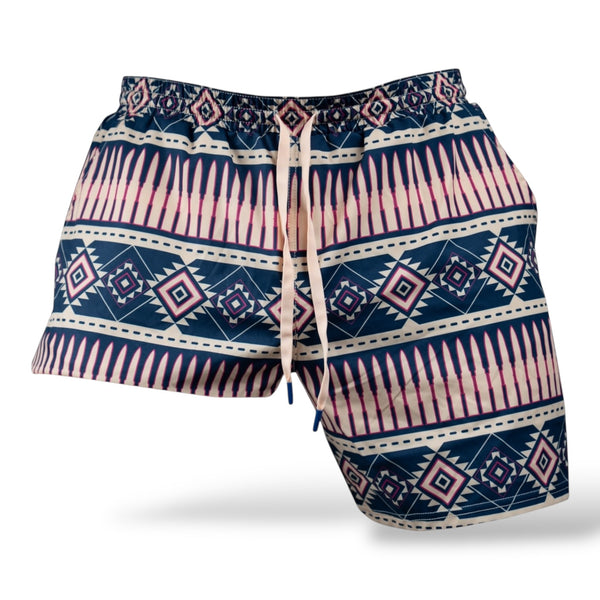 Savage Tacticians men's swim trunks with navy and pink geometric tribal pattern