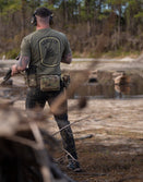 Man outdoors in tactical gear and Savage Tacticians 'Send It' shirt holding rifle