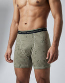 Male model wearing Savage Tacticians camo boxer briefs with logo waistband