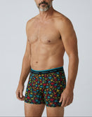 Man modeling Savage Tacticians colorful patterned boxer briefs with branded waistband