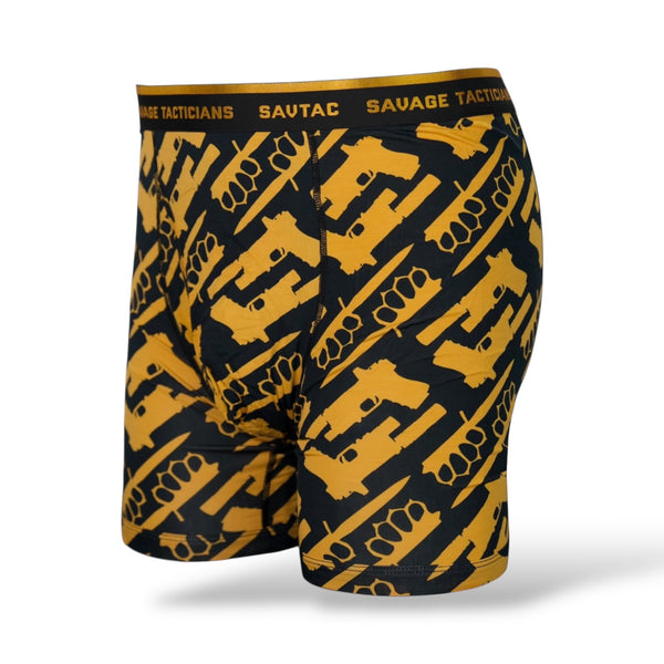 Savage Tacticians boxer briefs with yellow gun and brass knuckle pattern on black fabric