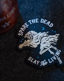 Savage Tacticians patch with skeleton reaper, cloak, crescent moon, text 'Spare the Dead Slay the Living'.