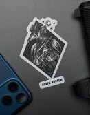 Savage Tacticians Carpe Noctem sticker with tactical figure, gun, and smartphone on gray surface