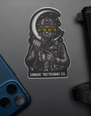 Savage Tacticians sticker featuring tactical soldier with night vision goggles on a grey surface