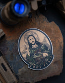 Savage Tacticians sticker featuring a bearded man in camo holding a pistol, labeled God's Plaid