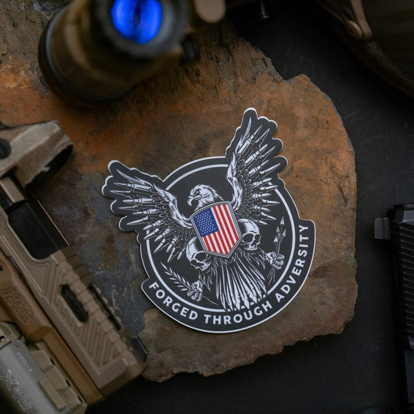 Savage Tacticians eagle sticker with American flag shield and 'Forged Through Adversity' text