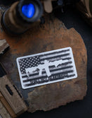 Savage Tacticians sticker with AR-15 rifle and American flag on stone, tactical gear background