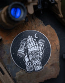 Savage Tacticians sticker with praying hands, night vision goggles, tactical gear background