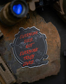 Savage Tacticians sticker with 'Everyone dies, not everyone truly lives' text on stone surface