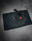 Savage Tacticians flag with pirate skeleton and rifle on dark concrete floor