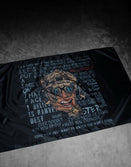 Savage Tacticians flag featuring a grinning tactical helmeted face and bold motivational text