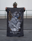 Person with tactical helmet holding Savage Tacticians flag featuring tattooed angel design
