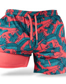 Savage Tacticians coral athletic shorts with teal palm and flamingo pattern