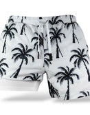 Savage Tacticians white shorts with black palm tree and rifle pattern, dual layer design