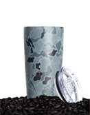 Savage Tacticians camo tumbler with clear lid on coffee beans
