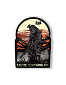 Savage Tacticians samurai patch with modern rifle, sunset, helicopter, and mountains