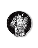 Savage Tacticians praying hands sticker with binoculars, tattoos, and night sky background