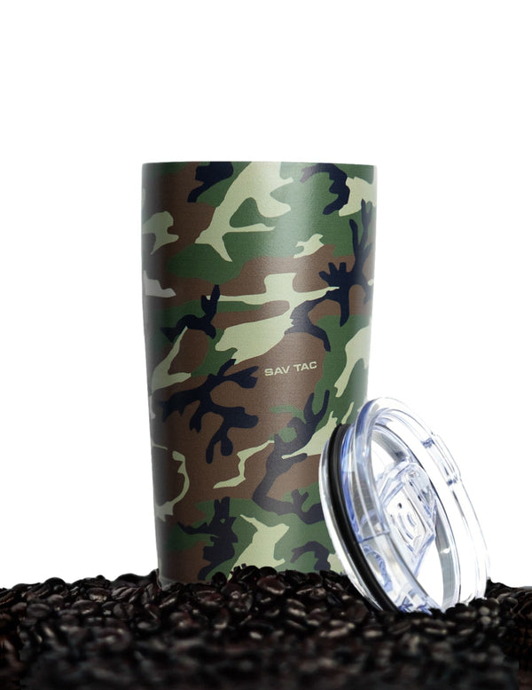 Savage Tacticians camo insulated tumbler with lid on coffee beans