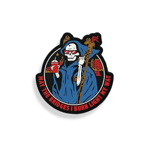 Savage Tacticians patch with skeleton in blue cloak, holding rifle and drink, wearing red shades