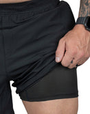 Savage Tacticians black athletic shorts with mesh inner lining, close-up view