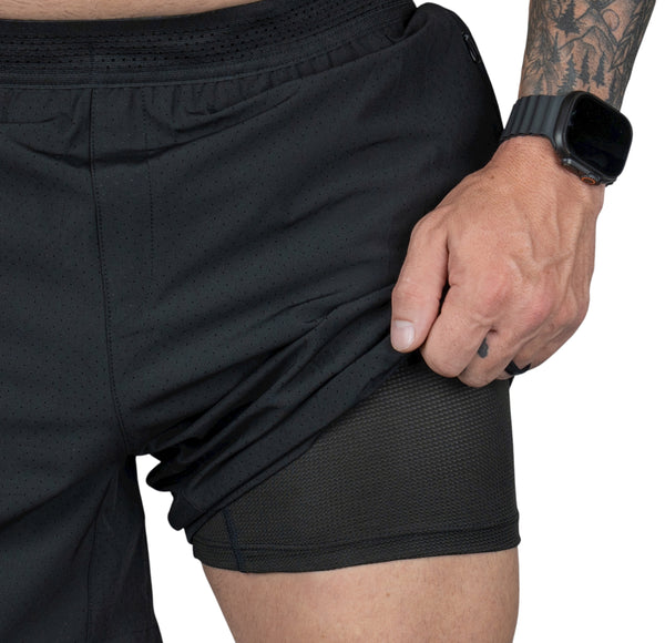 Savage Tacticians black athletic shorts with mesh inner lining, close-up view